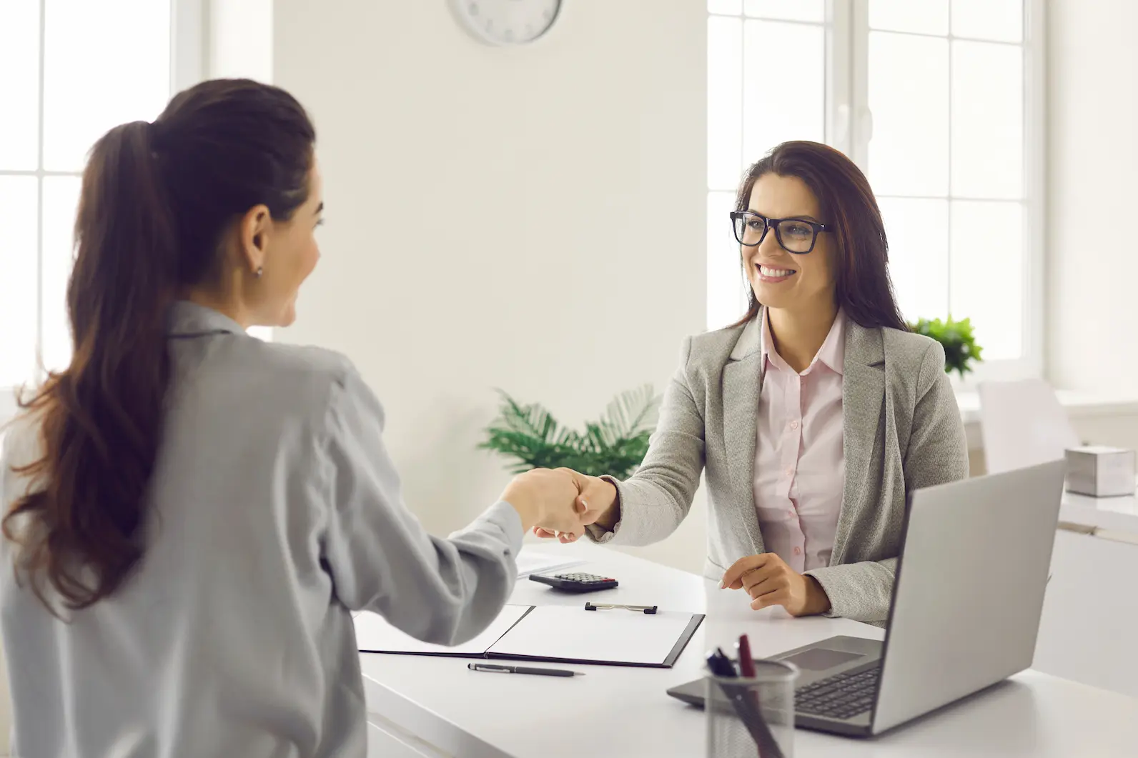 Image of Happy client, shaking hands with Service provider